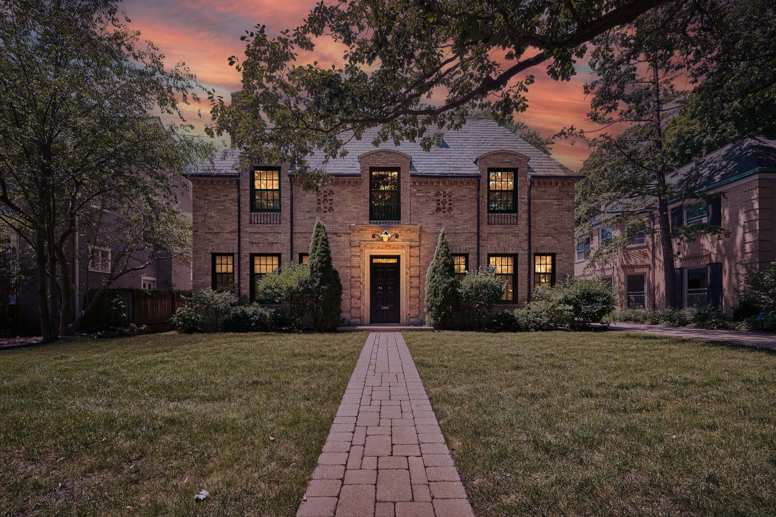 A brick North Shore home at twilight
