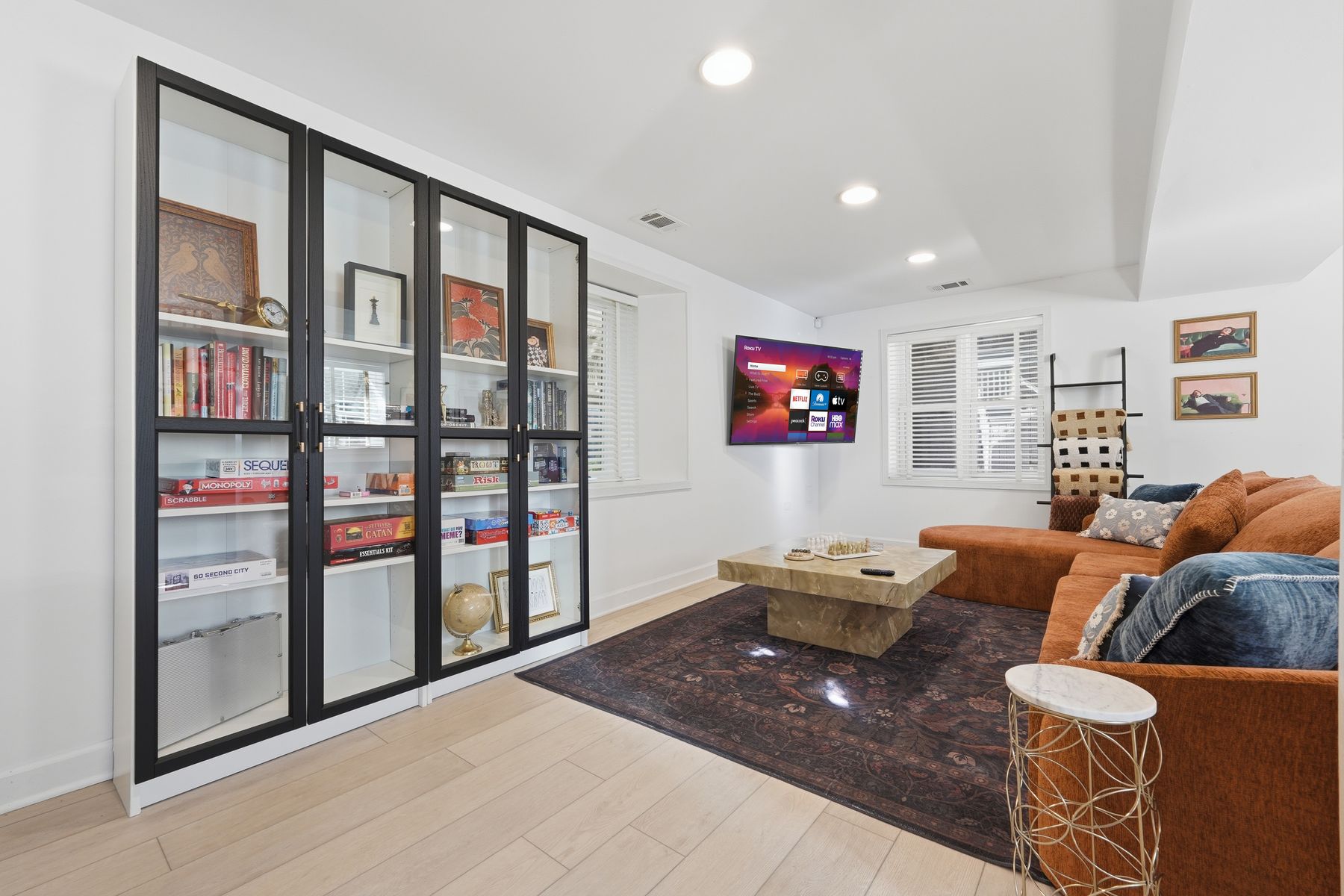 Living room with a glass bookcase wall, Wicker Park
